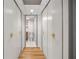 Hallway lined with closets, leading to a bathroom with white tiles and modern fixtures at 620 Peachtree Ne St # 1412, Atlanta, GA 30308