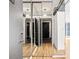 Hallway with mirrored closet doors and wood floors, reflecting modern design at 620 Peachtree Ne St # 1412, Atlanta, GA 30308