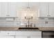 Kitchen detail showcasing granite countertops and subway tile backsplash at 620 Peachtree Ne St # 1412, Atlanta, GA 30308