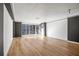 Spacious living room with hardwood floors and floor to ceiling windows at 620 Peachtree Ne St # 1412, Atlanta, GA 30308