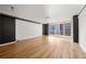 Spacious living room with hardwood floors and floor to ceiling windows at 620 Peachtree Ne St # 1412, Atlanta, GA 30308