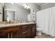 Double vanity bathroom with granite countertops and a shower/tub at 2603 Apple Valley Ne Rd, Brookhaven, GA 30319