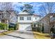 Two-story house with white siding, stone accents, and a two-car garage at 2603 Apple Valley Ne Rd, Brookhaven, GA 30319