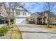 Two-story house with white siding, stone accents, and a two-car garage at 2603 Apple Valley Ne Rd, Brookhaven, GA 30319
