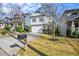 Two-story house with white siding, stone accents, and a two-car garage at 2603 Apple Valley Ne Rd, Brookhaven, GA 30319