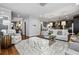 Open living room with hardwood floors, plush seating, and views into the kitchen at 2603 Apple Valley Ne Rd, Brookhaven, GA 30319