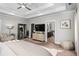 Main bedroom with large TV, comfortable seating, and en-suite bathroom access at 2603 Apple Valley Ne Rd, Brookhaven, GA 30319