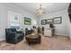 Home office with leather chairs, large art, and a home bar at 2603 Apple Valley Ne Rd, Brookhaven, GA 30319