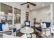 Bright and airy screened porch with wicker furniture and a ceiling fan at 2603 Apple Valley Ne Rd, Brookhaven, GA 30319