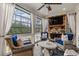 Relaxing screened porch with fireplace, wicker furniture, and large windows at 2603 Apple Valley Ne Rd, Brookhaven, GA 30319