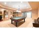 Finished basement showcasing a pool table and multiple entertainment areas at 308 Hillpine Dr, Woodstock, GA 30189