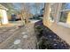 Stone pathway and landscaping beside home exterior at 308 Hillpine Dr, Woodstock, GA 30189