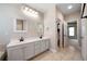 Double vanity bathroom with tiled floor and separate toilet area at 12 Spruce Ne St, White, GA 30184