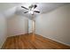 Bedroom with hardwood floors and access to bathroom at 12 Spruce Ne St, White, GA 30184