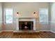 Stone fireplace with wood mantel in living room at 12 Spruce Ne St, White, GA 30184