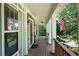 Front porch view showing a wooden floor and railing at 12 Spruce Ne St, White, GA 30184