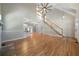 High-ceiling living room with hardwood floors and fireplace at 12 Spruce Ne St, White, GA 30184