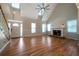 Open living room with hardwood floors, high ceilings, and fireplace at 12 Spruce Ne St, White, GA 30184