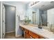 Clean bathroom with light blue walls, wooden vanity, and shower at 228 Ridge Mill Dr, Acworth, GA 30102