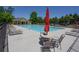 Community swimming pool with lounge chairs and tables at 228 Ridge Mill Dr, Acworth, GA 30102