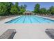 Large community swimming pool with plenty of lounge chairs at 228 Ridge Mill Dr, Acworth, GA 30102