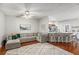 Living room with sectional sofa, green chairs, and hardwood floors at 228 Ridge Mill Dr, Acworth, GA 30102