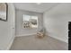 Bright bedroom with plush carpeting and a comfortable armchair at 5330 Austrian Pine Ct, Cumming, GA 30040