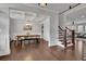 Open concept dining room with hardwood floors and access to the kitchen at 5330 Austrian Pine Ct, Cumming, GA 30040