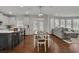 Open concept kitchen and dining area with hardwood floors at 5330 Austrian Pine Ct, Cumming, GA 30040