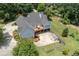 Aerial view of the house, deck, and surrounding area at 675 Jack Page Ln, Canton, GA 30115