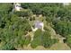 House nestled in a large wooded lot, aerial view at 675 Jack Page Ln, Canton, GA 30115