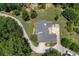 Aerial view of house, driveway, and surrounding landscape at 675 Jack Page Ln, Canton, GA 30115