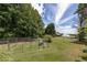 Large backyard with fenced garden and a view of the property at 675 Jack Page Ln, Canton, GA 30115