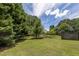 Fenced backyard with mature trees and open space at 675 Jack Page Ln, Canton, GA 30115