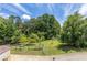 Large backyard with fenced dog run and garden area at 675 Jack Page Ln, Canton, GA 30115