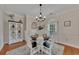 Bright dining room features a charming table setting and decorative cabinet at 675 Jack Page Ln, Canton, GA 30115