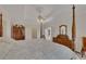 Main bedroom with a king-size bed, dresser, and ceiling fan at 675 Jack Page Ln, Canton, GA 30115