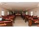 Large sanctuary with wooden pews and a raised stage at 1065 Benteen Se Ave, Atlanta, GA 30312