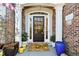 Elegant front door with decorative planters and mat at 1239 Bonshaw Trl, Marietta, GA 30064