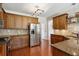 Modern kitchen with stainless steel appliances and granite countertops at 1239 Bonshaw Trl, Marietta, GA 30064