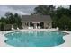 Community pool with clubhouse and shade umbrellas at 1239 Bonshaw Trl, Marietta, GA 30064