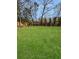 Expansive backyard featuring a well-maintained lawn and mature trees at 2571 Sharondale Ne Dr, Atlanta, GA 30305