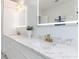 Double vanity bathroom with marble countertops and LED mirrors at 2571 Sharondale Ne Dr, Atlanta, GA 30305