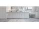 Double vanity bathroom with marble countertops and white cabinets at 2571 Sharondale Ne Dr, Atlanta, GA 30305