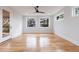 Bright bedroom with hardwood floors, large windows, and a private door to a balcony at 2571 Sharondale Ne Dr, Atlanta, GA 30305