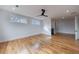 Spacious bedroom with hardwood floors, ceiling fan, and access to another room at 2571 Sharondale Ne Dr, Atlanta, GA 30305