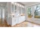 Butlery features white cabinets, marble countertops, and glass-front doors at 2571 Sharondale Ne Dr, Atlanta, GA 30305
