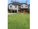 Modern two-story home featuring a well-manicured lawn and an attached two-car garage at 2571 Sharondale Ne Dr, Atlanta, GA 30305