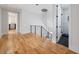 Hardwood floor hallway, modern light fixture, and a view of a stylish bathroom at 2571 Sharondale Ne Dr, Atlanta, GA 30305