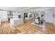 Open concept kitchen and dining area with marble island and hardwood floors at 2571 Sharondale Ne Dr, Atlanta, GA 30305